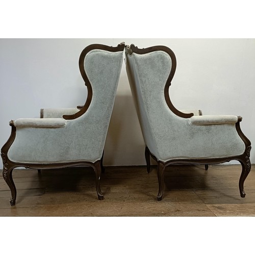 1270 - A pair of walnut framed wingback armchairs (2)