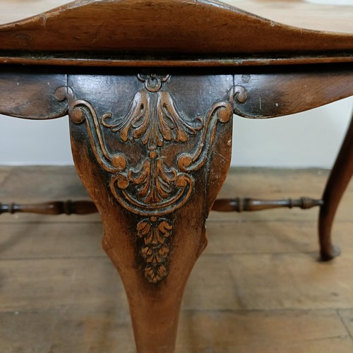 1280 - A 20th century walnut lily pad coffee table, on carved cabriole legs, 82 cm diameter