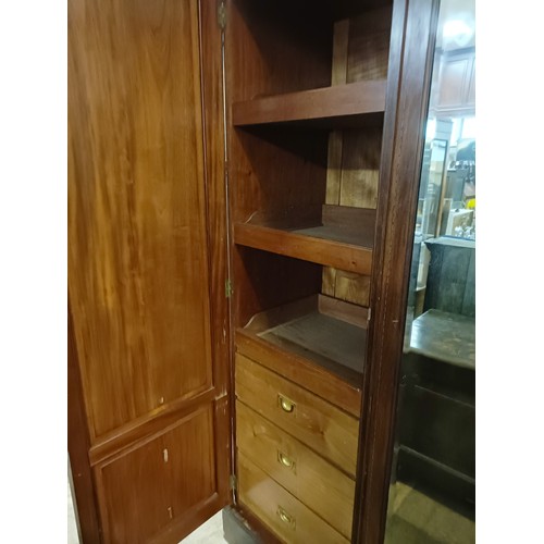 1285 - An early 20th century mahogany triple wardrobe, with a central mirrored door, 181 cm wide