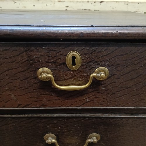 1209 - An oak chest, having two short and three long drawers, 100 cm wide