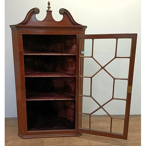 1306 - A mahogany corner cabinet, with a single glazed door, 72 cm wide