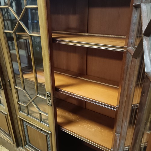 1232 - A mahogany breakfront bookcase, with five glazed doors, 206 cm wide