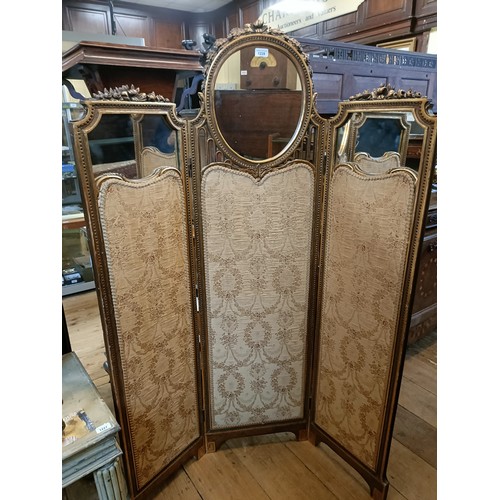 1228 - A gilt gesso three section folding screen, centre section with a mirror, 160 cm high