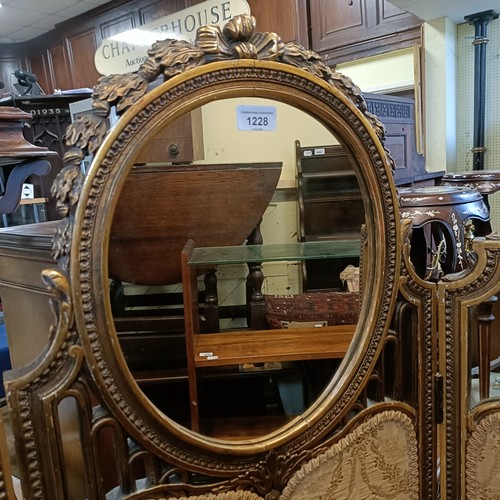 1228 - A gilt gesso three section folding screen, centre section with a mirror, 160 cm high