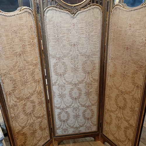 1228 - A gilt gesso three section folding screen, centre section with a mirror, 160 cm high