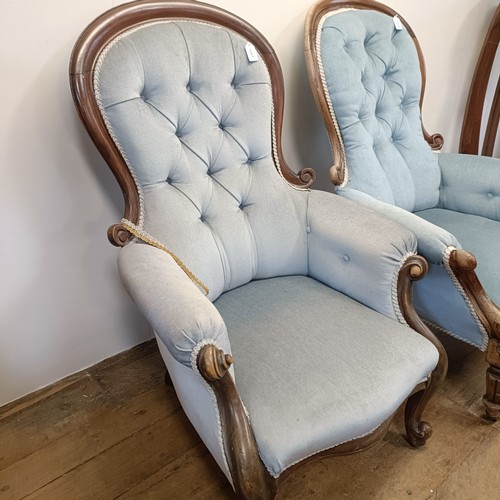 1257 - A Victorian mahogany framed button back armchair, and another similar (2)