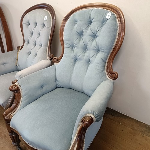 1257 - A Victorian mahogany framed button back armchair, and another similar (2)