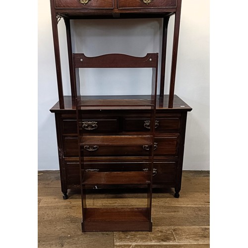 1318 - A mahogany open bookcase, 48 cm wide, a side table, 87 cm wide, and a walnut chest, having two short... 