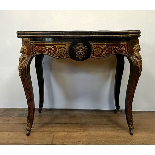 1292 - An early 20th century Boulle folding card table, with a replaced leather top, 85 cm wide