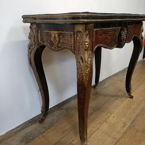 1292 - An early 20th century Boulle folding card table, with a replaced leather top, 85 cm wide