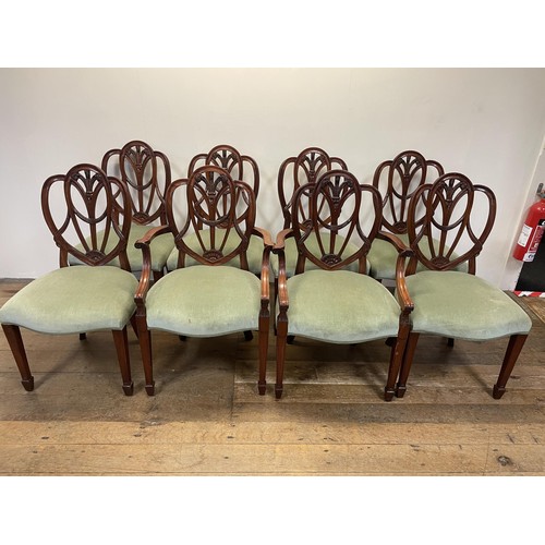 1260 - A set of eight mahogany dining chairs, with shaped pierced backs, to padded seats on square legs to ... 