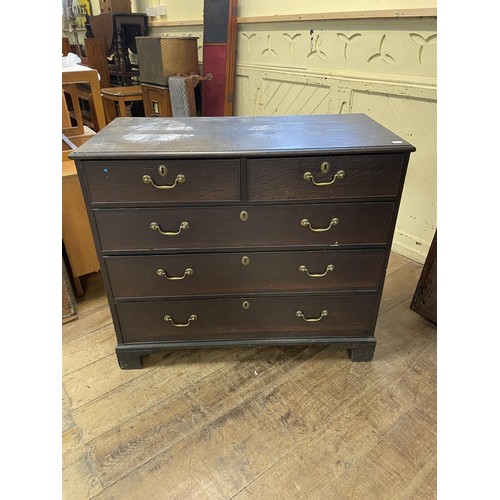 1209 - An oak chest, having two short and three long drawers, 100 cm wide