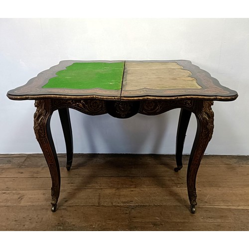 1292 - An early 20th century Boulle folding card table, with a replaced leather top, 85 cm wide