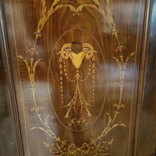 1289 - An early 20th century mahogany and marquetry inlaid triple wardrobe, with a central mirrored door, 1... 