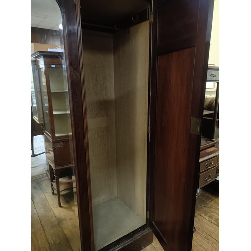 1289 - An early 20th century mahogany and marquetry inlaid triple wardrobe, with a central mirrored door, 1... 