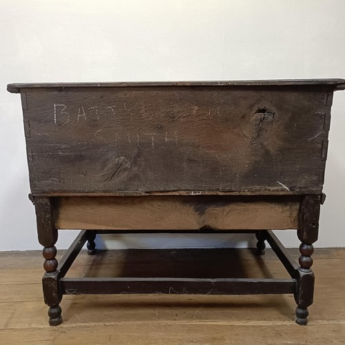 1294 - An oak box, with a hinged top, on a stand, 93 cm wide