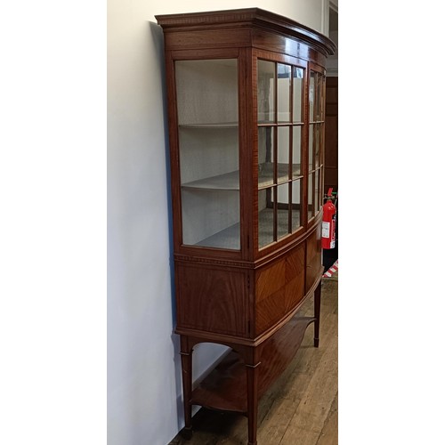 1300 - An early 20th century satinwood bow front display cabinet, 173 cm high x 116 cm wide