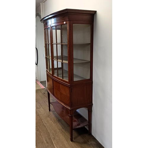 1300 - An early 20th century satinwood bow front display cabinet, 173 cm high x 116 cm wide