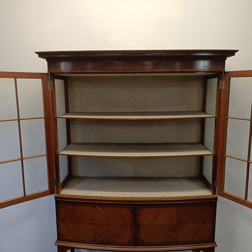 1300 - An early 20th century satinwood bow front display cabinet, 173 cm high x 116 cm wide