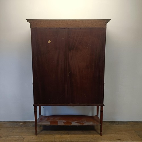 1300 - An early 20th century satinwood bow front display cabinet, 173 cm high x 116 cm wide