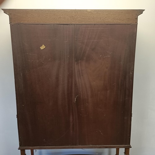 1300 - An early 20th century satinwood bow front display cabinet, 173 cm high x 116 cm wide