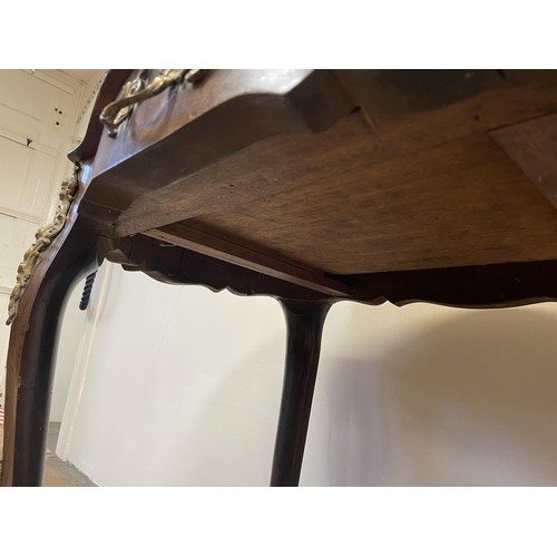 1309 - A French walnut serpentine table, with a single freeze drawer, with gilt metal mounts, 90 cm wide