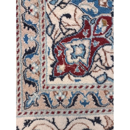 1352 - A Persian cream ground carpet, centre with repeating foliate forms, with multiple borders, 243 x 192... 