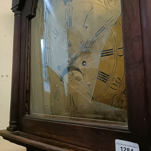 1284 - A longcase clock, with a brass dial, subsidiary date and seconds dial, and a painted moon phase dial... 