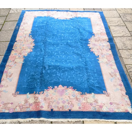 1363 - A large Chinese carpet, decorated flowers and foliage, 336 x 242 cm