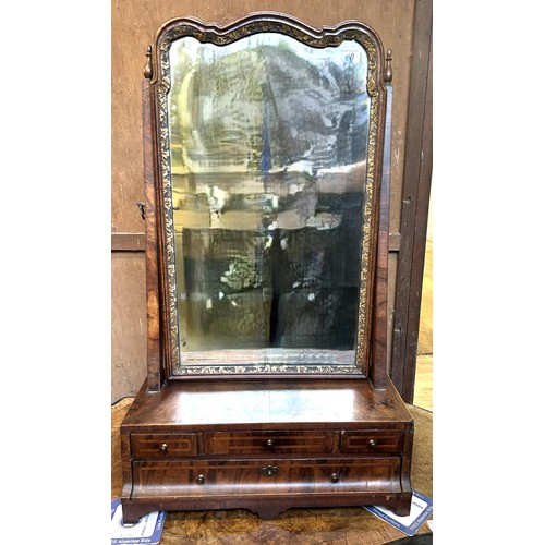 1310 - A 19th century walnut and gilt gesso bedroom mirror, the base having four drawers, 79 x 44 cm