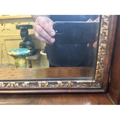 1310 - A 19th century walnut and gilt gesso bedroom mirror, the base having four drawers, 79 x 44 cm