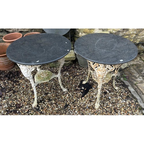 1357 - A pair of Britannia type cast iron bases, with later tops, 71 cm diameter (2)