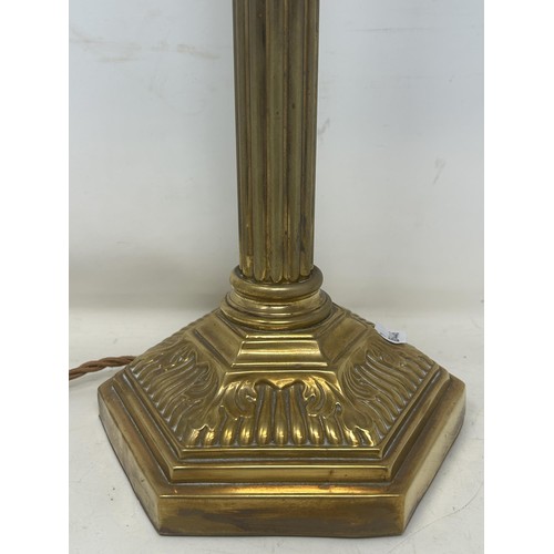 1088 - A brass table lamp, in the form of a Corinthian column, 35 cm