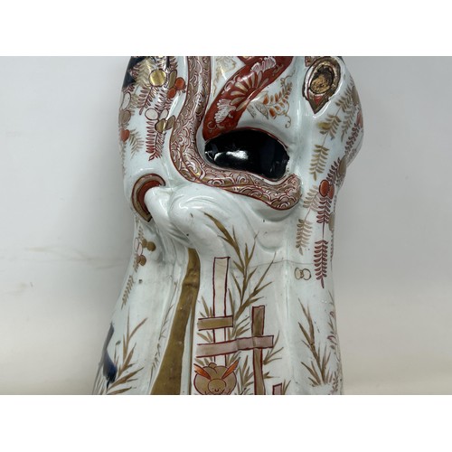 1091 - A Japanese Imari figure, with a painted wooden head, 50 cm high