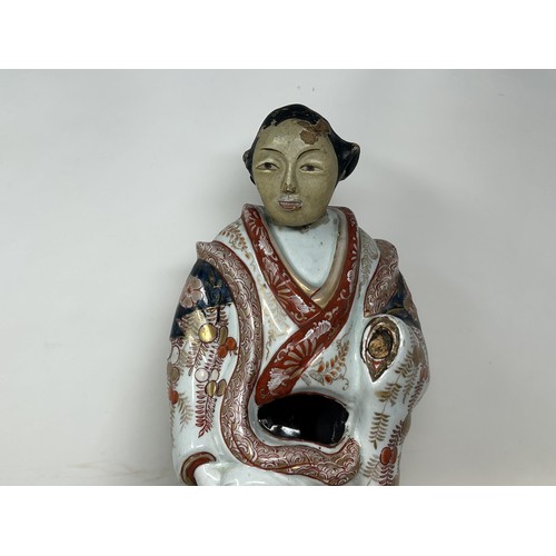 1091 - A Japanese Imari figure, with a painted wooden head, 50 cm high