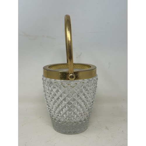 1096 - A cut glass ice bucket, with gilt metal mounts, 26 cm high