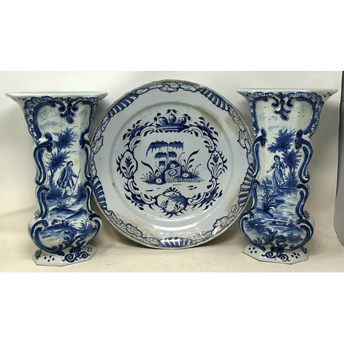 1103 - A pair of Delft vases, 33 cm high, and a Delft plate, 37 cm high (3)