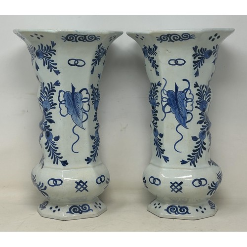 1103 - A pair of Delft vases, 33 cm high, and a Delft plate, 37 cm high (3)