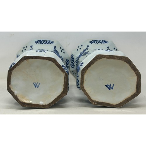 1103 - A pair of Delft vases, 33 cm high, and a Delft plate, 37 cm high (3)