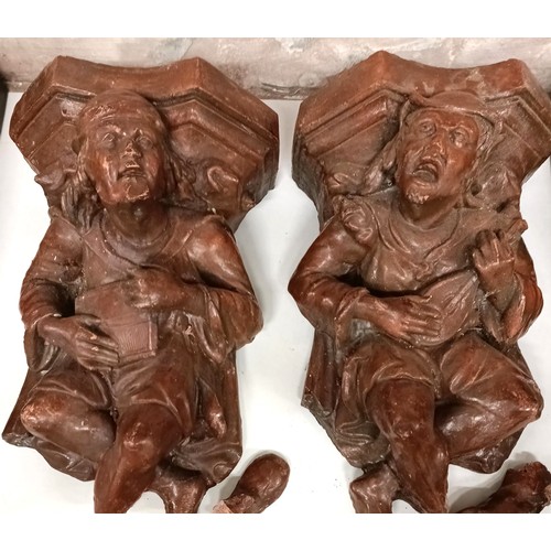 1030 - A pair of plaster figural wall mounts, 33 cm wide (2)...