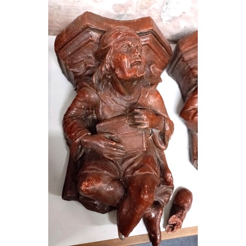 1030 - A pair of plaster figural wall mounts, 33 cm wide (2)...