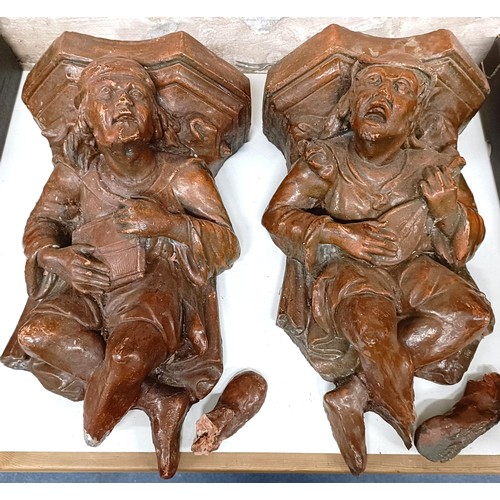 1030 - A pair of plaster figural wall mounts, 33 cm wide (2)