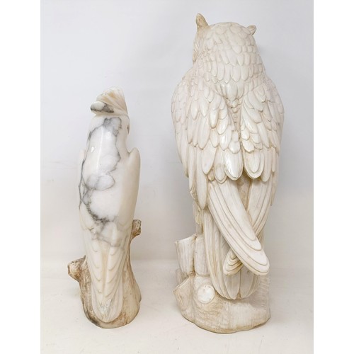 1049 - A carved stone owl, 43 cm high, and a soapstone cockatoo, crest broken, 32 cm high (2)