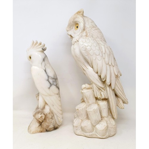 1049 - A carved stone owl, 43 cm high, and a soapstone cockatoo, crest broken, 32 cm high (2)