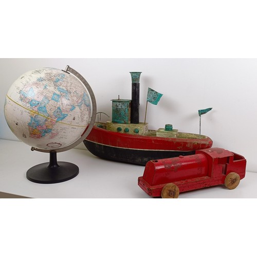 1050 - A wooden toy tug boat, 40 cm high, a similar locomotive, and a Replogle World Classic Series globe (... 