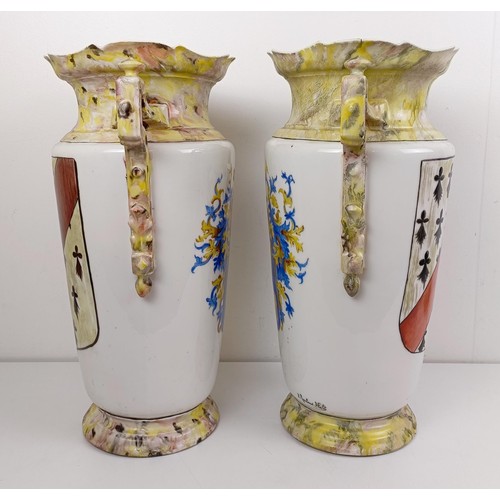 1104 - A pair of late 19th/early 20th century French vases, decorated armorials, 44 cm high (2)