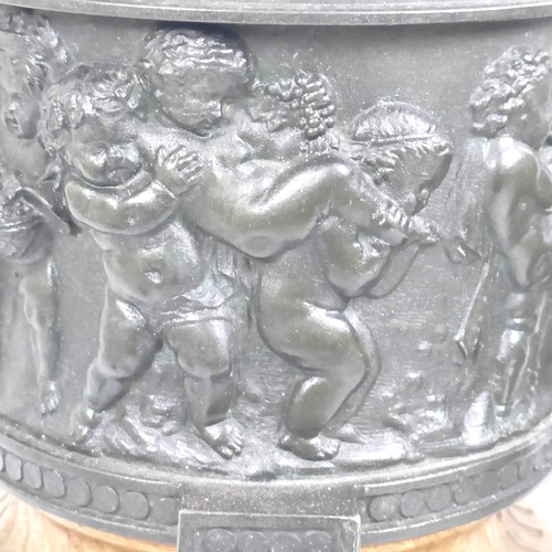 1080 - A pair of brass and bronze urns, with covers, with cherub finials on wooden bases, 40 cm high (2)