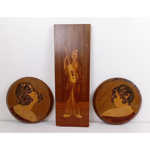 1083 - A pair of panels, inlaid with Art Deco style portrait of ladies, 22 cm diameter, and another of a cl... 