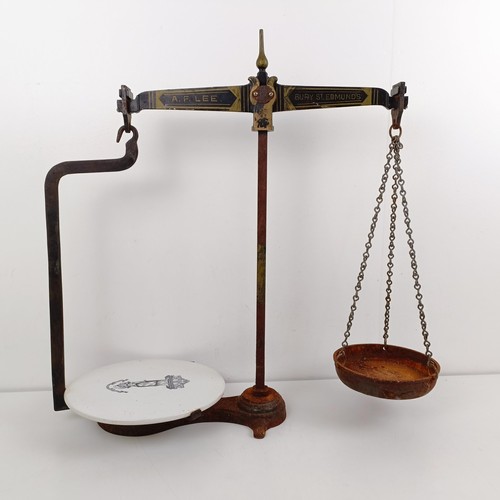 1087 - A set of scales by A F Lee of Bury St Edmunds, 62 cm high