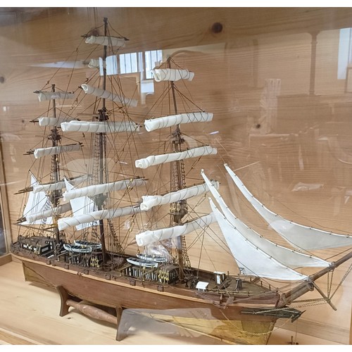 1144 - A model of the Cutty Sark, in a glazed case, 70 x 106 cm